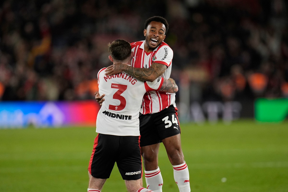 Southampton's Welington, right, and Ryan Manning celebrate at the final whistle in the EFL Championship play off semifinal soccer game between Southampton and Middlesbrough, Tuesday, May 12, 2026 ...