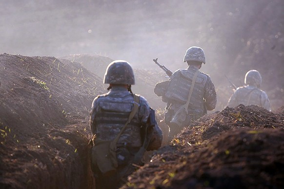 Armenian soldiers take their position on the front line in Tavush region, Armenia, Tuesday, July 14, 2020. Skirmishes on the volatile Armenia-Azerbaijan border escalated Tuesday, marking the most seri ...