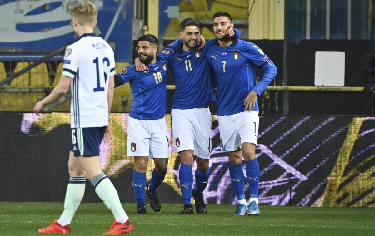 Italy's Domenico Berardi, second right, celebrates after scoring the first goal during the World Cup 2022 qualifier group c soccer game between Italy and Northern Ireland at the Stadio Ennio Tard ...