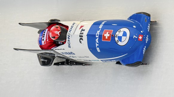 Michael Vogt and Sandro Michel, of Switzerland, take a turn during the first run of the men's bobsled World Cup race on Saturday, Dec. 17, 2022, in Lake Placid, N.Y. (AP Photo/Hans Pennink)
Michael Vo ...