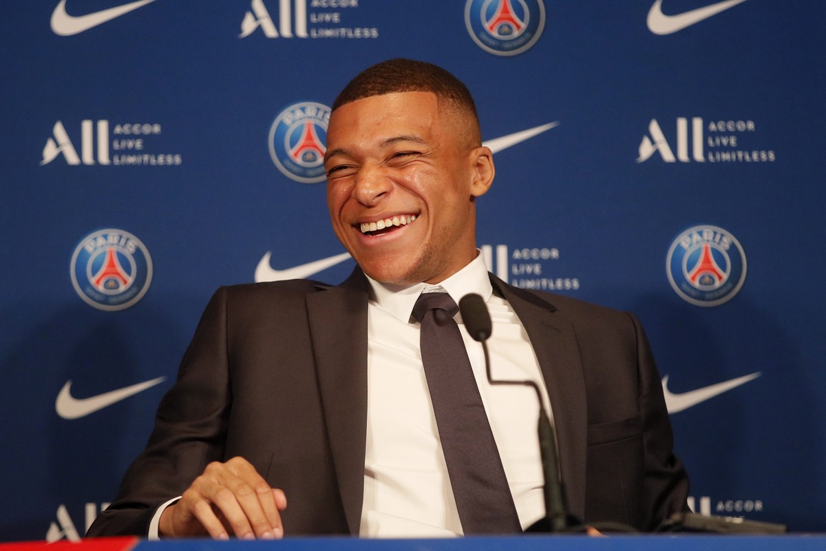 PSG striker Kylian Mbappe laughs during a press conference Monday, May 23, 2022 at the Paris des Princes stadium in Paris. Kylian Mbappé's decision to reject Real Madrid and commit to Paris Saint ...