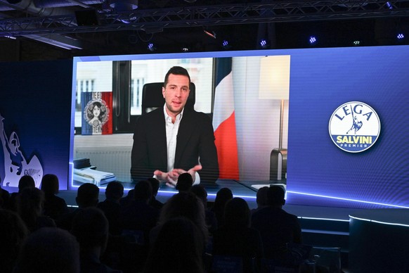 epa12013490 President of the French National Rally (RN) Jordan Bardella speaks via a video link during the Federal Congress of the League (Lega) at the Fortezza da Basso in Florence, Italy, 06 April 2 ...