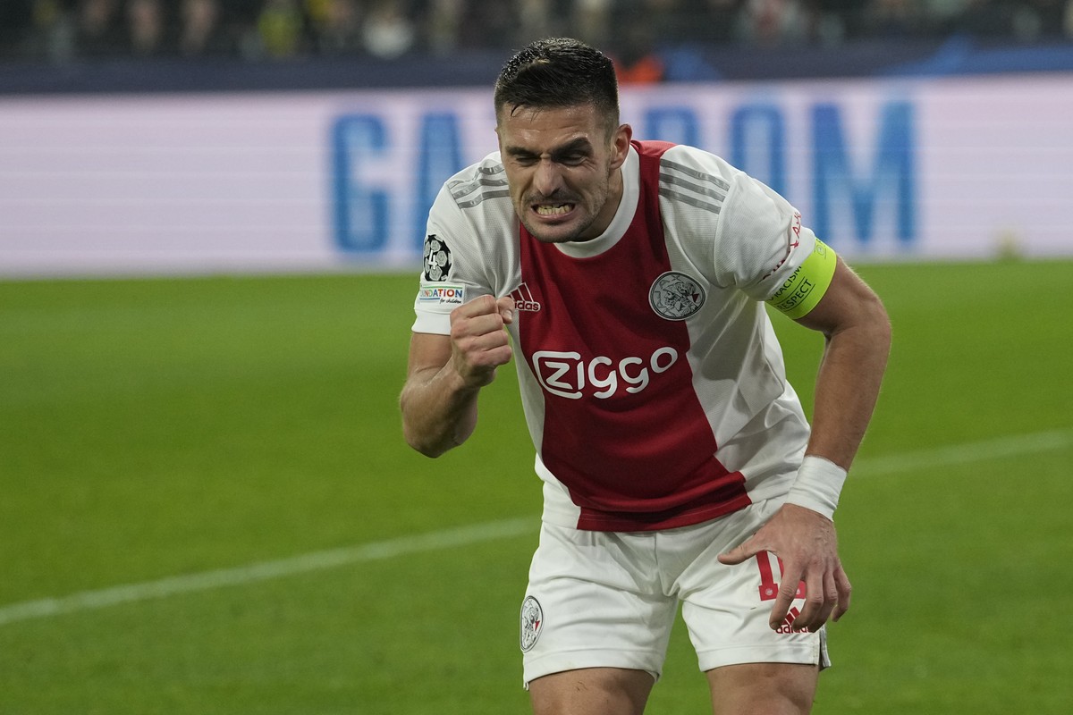 Ajax's Dusan Tadic celebrates after scoring his side's opening goal during the Champions League group C soccer match between Borussia Dortmund and Ajax Amsterdam in Dortmund, Germany, Wednes ...