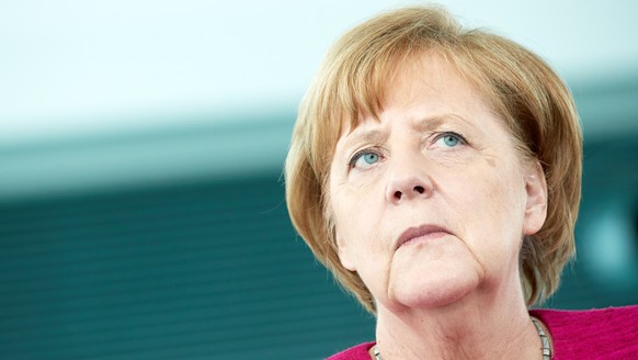 epa06810339 German Chancellor Angela Merkel receives the Alexander Ruestow badge of the Action Community Social Market Economy at the German Chancellery in Berlin, Germany, 15 June 2018. The non-profi ...