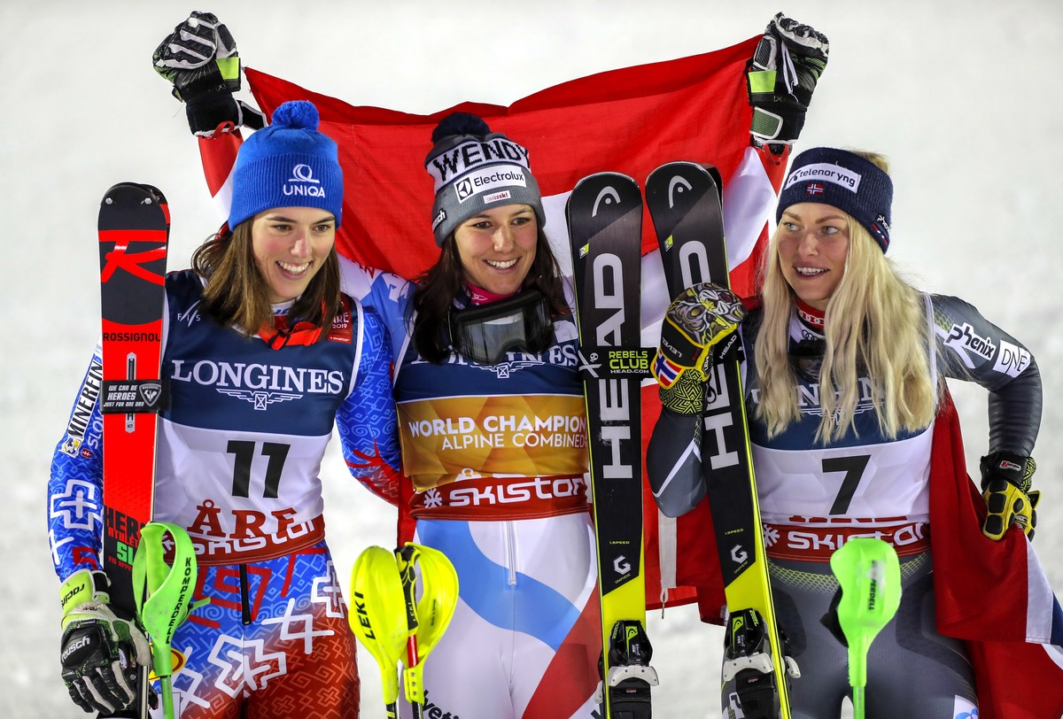 epa07353205 (L-R) second placed Petra Vlhova of Slovakia, winner Wendy Holdener of Switzerland and third placed Ragnhild Mowinckel of Norway celebrate on the podium for the Women's Alpine Combine ...