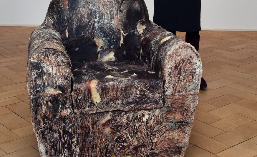 epa04978506 Museum director Stefanie Dathe poses behind a beef-covered armchair by Czech-Canadian artist Jana Sterbak at Villa Rot museum in Burgrieden, Germany, 15 October 2015. The exhibition &#039; ...