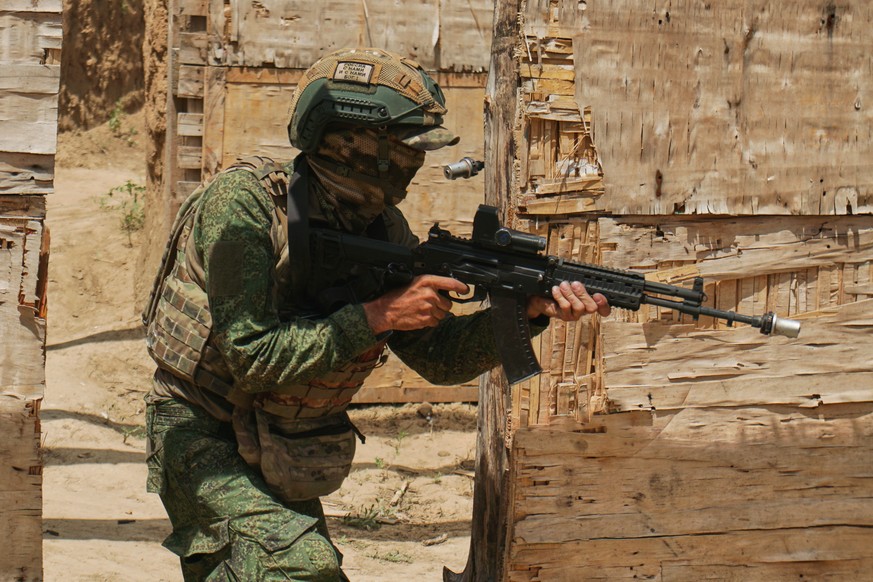 In this photo taken from video distributed by Russian Defense Ministry Press Service on Thursday, Sept. 25, 2025, a Russian soldier fires during a practice at a training ground on an undisclosed locat ...