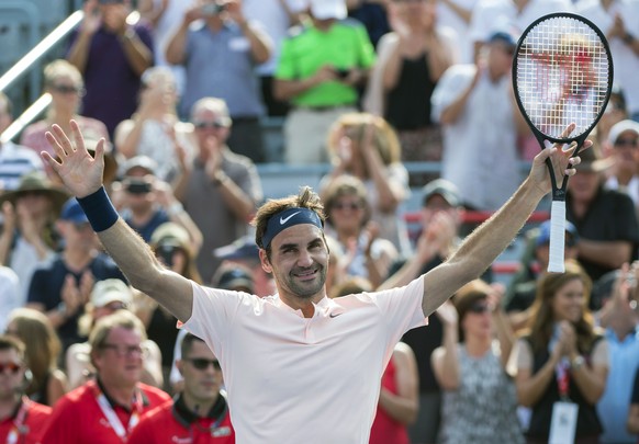 Roger Federer, of Switzerland, celebrates his victory over Roberto Bautista Agut, of Spain, during quarterfinal play at the Rogers Cup tennis tournament, Friday Aug. 11, 2017, in Montreal. (Paul Chias ...