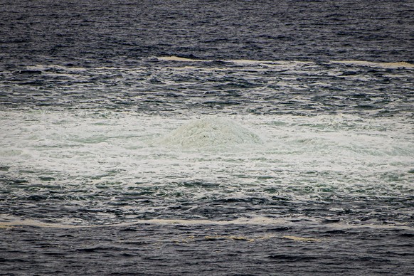 In this photo provided by the Armed Forces of Denmark, a view the disturbance in the water above the gas leak, in the Baltic Sea, Thursday, Sept. 29, 2022. Following the suspected sabotage this week o ...