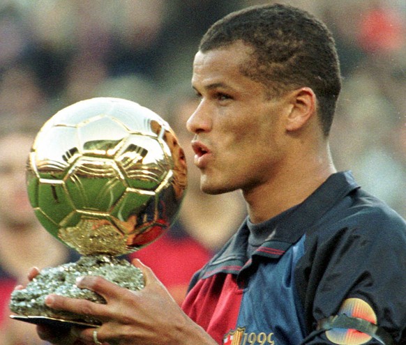 Barcelona&#039;s Brazilian stiker Rivaldo kisses the Golden Ball award he recieved from France&#039;s prestigious football magazine France Football in Barcelona&#039;s Camp Nou stadium Sunday January  ...