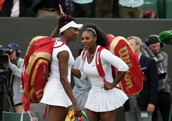 FILE -Serena Williams, right, and her sister Venus of the U.S celebrate after winning their women's doubles match against Andreja Klepac and Katarina Srebotnik of Slovenia on day four of the Wimb ...