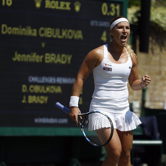 Slovakia&#039;s Dominika Cibulkova celebrates a point during the Women&#039;s Singles Match against Jennifer Brady of the United States, on day three at the Wimbledon Tennis Championships in London We ...