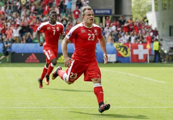 Switzerland&#039;s Xherdan Shaqiri, center, celebrates after scoring his sideÂs first goal during the Euro 2016 round of 16 soccer match between Switzerland and Poland, at the Geoffroy Guichard stadi ...