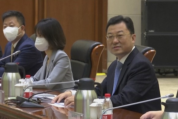 In this image taken from a July 26, 2021, video footage run by Phoenix TV via AP Video, China's Deputy Foreign Minister Xie Feng looks up before talks with visiting U.S. officials at the Tianjin Binhai No. 1 Hotel in the Tianjin municipality in China. China came out swinging at high-level face-to-face talks with the United States on Monday, blaming the U.S. for a &quot;stalemate&quot; in bilateral relations and calling on America to change &quot;its highly misguided mindset and dangerous policy.&quot; (Phoenix TV via AP Video)
Xie Feng