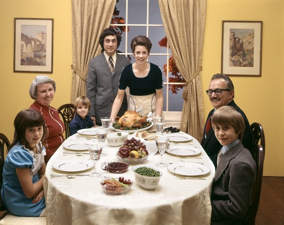 1970s 3 GENERATION FAMILY TURKEY DINNER (Photo by H. Armstrong Roberts/ClassicStock/Getty Images)