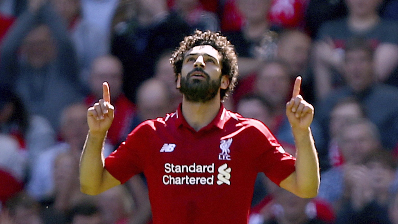 Liverpool&#039;s Mohamed Salah celebrates scoring his side&#039;s first goal of the game during their English Premier League soccer match against Brighton &amp; Hove Albion at Anfield, Liverpool. Engl ...