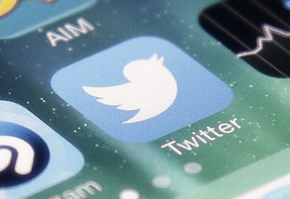 FILE - This Nov. 4, 2013, file photo shows the icon for the Twitter app on an iPhone in San Jose, Calif. Twitter, in a call with executives Thursday, July 7, 2022, said it removes 1 million spam accou ...