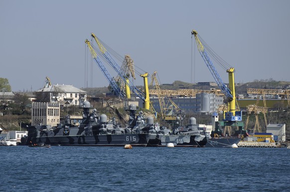 FILE - Russian Black Sea fleet ships are anchored in one of the bays of Sevastopol, Crimea, March 31, 2014. On Saturday, Oct. 29, 2022 at least two Russian ships suffered damage in a major port in Cri ...