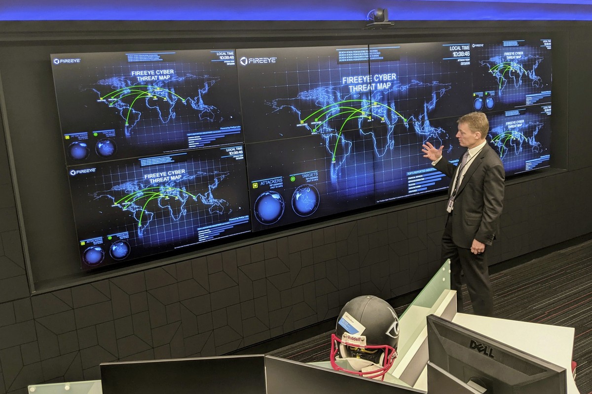 The CEO of FireEye Kevin Mandia gives a tour of the cybersecurity company's unused office space in Reston, Va., Tuesday, March 9, 2021. Mandia said 550 of his employees are working remotely and r ...