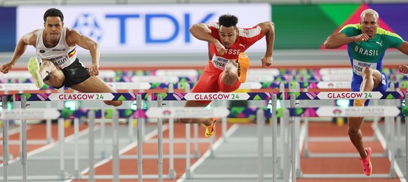 epa11193066 Jason Joseph (C) of Switzerland competes in a Men?s 60m Hurdles heat at the World Athletics Indoor Championships in Glasgow, Britain, 02 March 2024. EPA/ROBERT PERRY