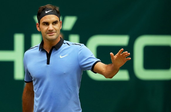 epa06047394 Roger Federer of Switzerland reacts during his semi final match against Karen Khachanov of Russia at the ATP tennis tournament in Halle, Germany, 24 June 2017. EPA/TYLER LARKIN