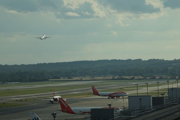 epa12273369 A plane takes off at Gatwick Airport in Crawley, Britain, 30 July 2025. An air traffic control fault caused major disruption to flights in the UK. EPA/ANDY RAIN