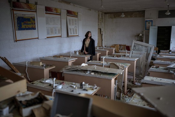 Surrounded by shards of broken glass and rubble 16-year-old Khrystyna Ignatova, sits at her desk in the remains of her classroom in the Chernihiv School #21, which was bombed by Russian forces on Marc ...