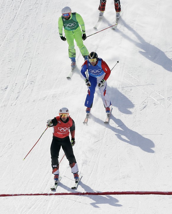 From top to bottom; FilipÂ Flisar, of Slovenia, ArnaudÂ Bovolenta, of France, and winner Armin Niederer, of Switzerland, finish their run during the men&#039;s ski cross small final at Phoenix Snow Pa ...