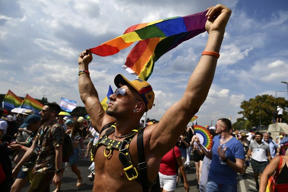 A person participates in a pride parade in Budapest, Hungary, Saturday, July 23, 2022. Members and supporters of Hungary&#039;s LGBTQ community marched through the capital on Saturday, amid an increas ...