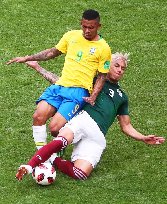 epa06858017 Gabriel Jesus (L) of Brazil in action against Carlos Salcedo (R) of Mexico during the FIFA World Cup 2018 round of 16 soccer match between Brazil and Mexico in Samara, Russia, 02 July 2018 ...