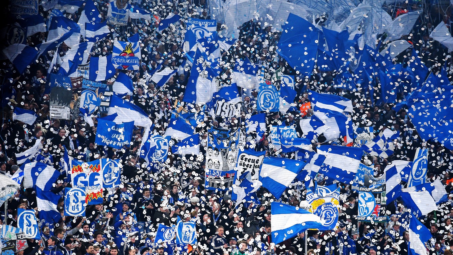 GELSENKIRCHEN, GERMANY - FEBRUARY 18: Schalke fans cheer on their team during the UEFA Champions League Round of 16 match between FC Schalke 04 and Real Madrid at the Veltins-Arena on February 18, 201 ...