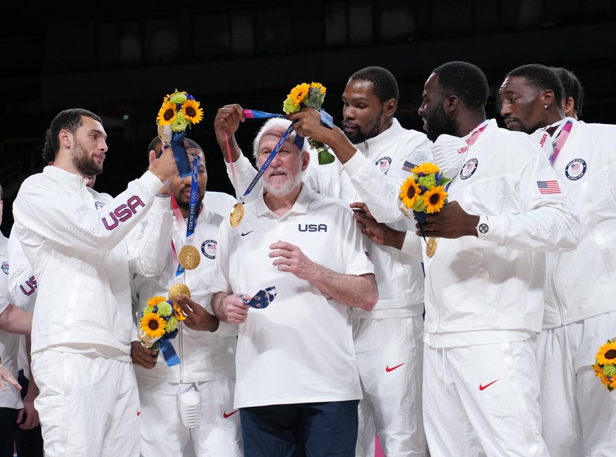 210808 -- SAITAMA, Aug. 8, 2021 -- Kevin Durant of the United States wears head coach Gregg Popovich a gold medal during the awarding ceremony for the men s basketball at the Tokyo 2020 Olympic Games, ...