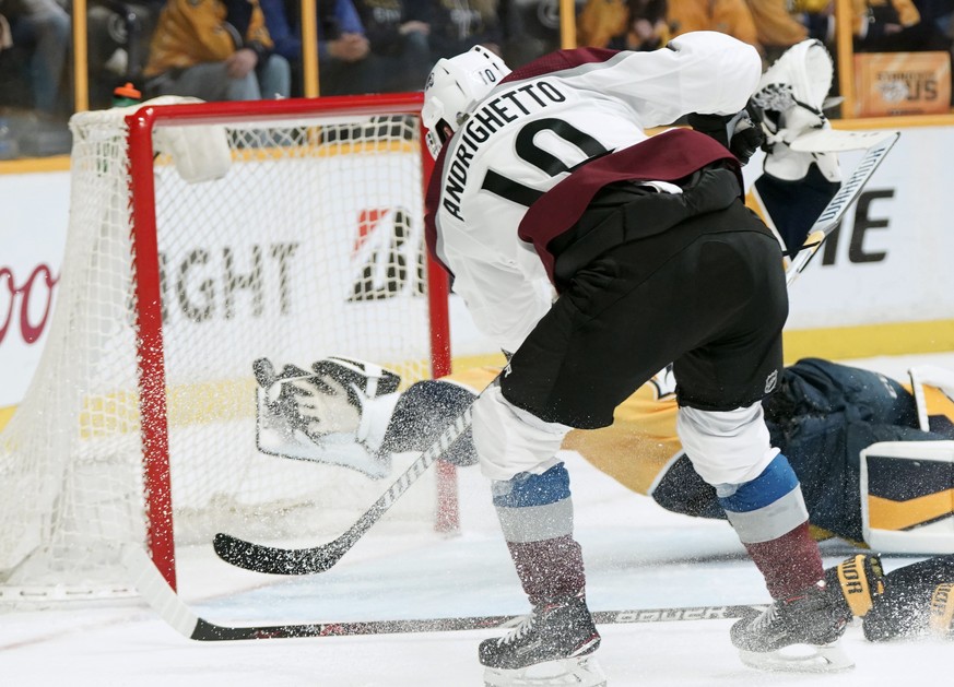 Colorado Avalanche right wing Sven Andrighetto (10), of Switzerland, fires a shot past the outstretched blocker hand of Nashville Predators goalie Pekka Rinne late in the third period in Game 5 of an  ...