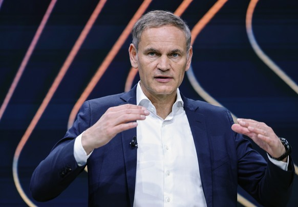 epa11955162 CEO of Volkswagen Group and Porsche, Oliver Blume, gestures as he speaks at Volkswagen&#039;s annual press conference in Wolfsburg, Germany, 11 March 2025. In 2024, Volkswagen marked a 30. ...