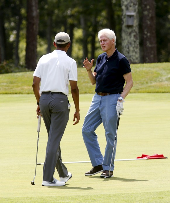 U.S. President Barack Obama and former President Bill Clinton play a round of golf together at Farm Neck Golf Club on Martha&#039;s Vineyard in Massachusetts, August 15, 2015. Obama and former Preside ...
