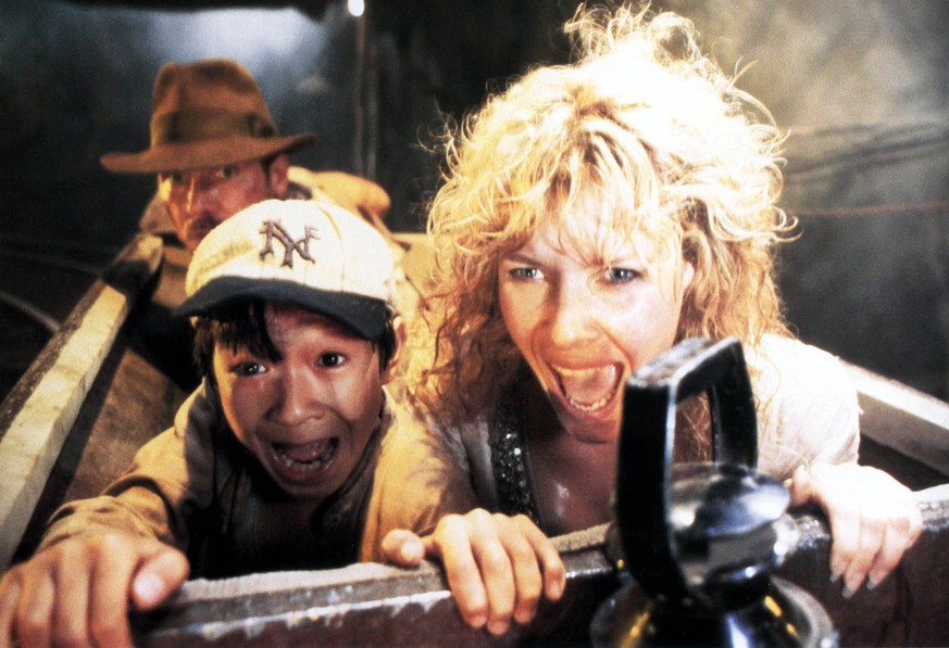 INDIANA JONES AND THE TEMPLE OF DOOM HARRISON FORD, KE HUY QUAN, KATE CAPSHAW Date: 1984. Strictly editorial use only in conjunction with the promotion of the film. Credit line mandatory. This image i ...