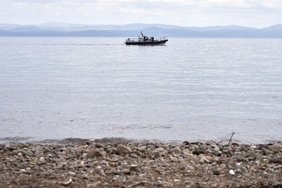 A Frontex vessel takes part in a search and rescue operation, after the capsizing of a boat carrying migrants, off the coast on the northeastern Aegean Sea island of Lesbos, Greece, Thursday, April 3, ...