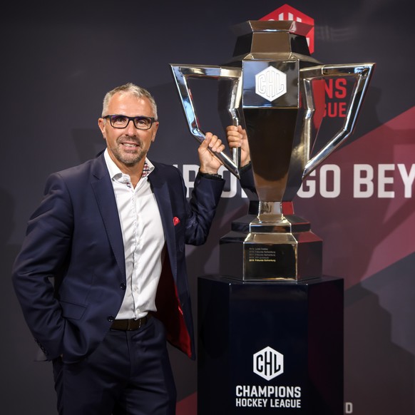 epa07780918 Champions Hockey League (CHL) CEO Martin Baumann poses next to the CHL Cup during a press conference about the current developments of the Champions Hockey League in Bern, Switzerland, 19  ...