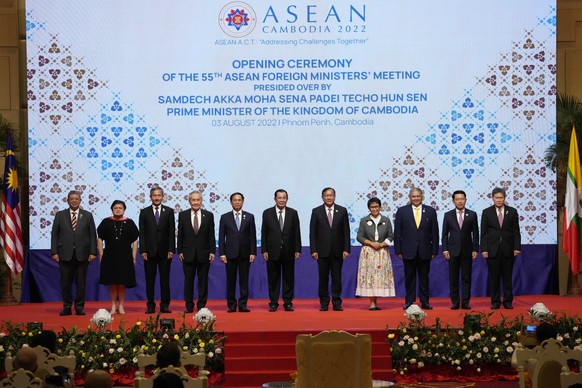 From left to right; Malaysian Foreign Minister Saifuddin Abdullah, Philippines Foreign Affairs acting Undersecretary Theresa Lazaro, Singapore Foreign Minister Vivian Balakrishnan, Thailand's Foreign Minister Don Pramudwinai, Vietnam Foreign Minister But Thanh Son, Cambodia's Prime Minister Hun Sen, Cambodia's Foreign Minister Peak Sokhonn, Indonesia's Foreign Minister Retno Marsudi, Brunei Second Minister of Foreign Affair Erywan Yusof, Laos Foreign Minister Saleumxay Kommasith, and Secretary-General of ASEAN Lim Jock Hoi poses for a group photograph during the opening for the 55th ASEAN Foreign Ministers' Meeting (55th AMM) in Phnom Penh, Cambodia, Wednesday, Aug. 3, 2022. (AP Photo/Heng Sinith)
Saifuddin Abdullah,Theresa Lazaro,Vivian Balakrishnan,Don Pramudwinai,But Thanh Son,Hun Sen,Peak Sokhonn,Retno Marsudi,Erywan Yusof,Saleumxay Kommasith,Lim Jock Hoi
