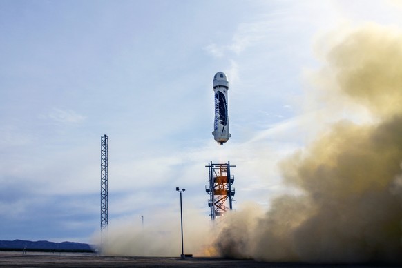 In this photo provided by Blue Origin taken on Monday, Nov. 23, 2015, an unmanned Blue Origin rocket blasts off in West Texas. The private company announced Tuesday, Nov. 24, that it had gotten the ro ...