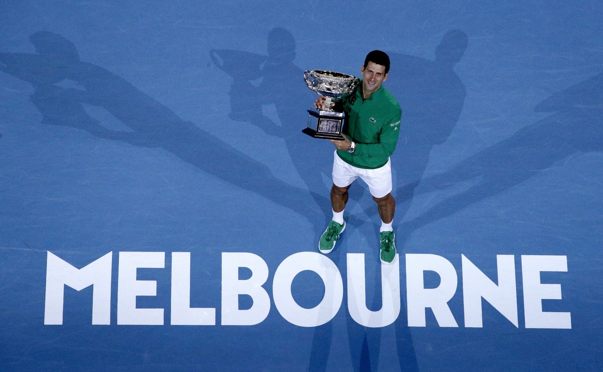 FILE - In this Monday, Feb. 3, 2020 file photo, Serbia's Novak Djokovic holds the Norman Brookes Challenge Cup after defeating Austria's Dominic Thiem in the men's singles final of the  ...