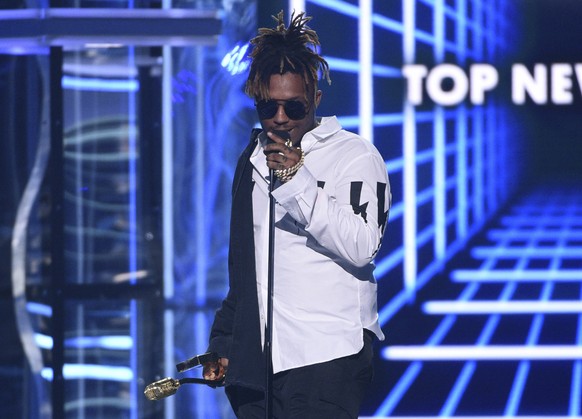 FILE - In this May 1, 2019 file photo, Juice WRLD accepts the award for top new artist at the Billboard Music Awards at the MGM Grand Garden Arena in Las Vegas. The Chicago-area rapper, whose real nam ...