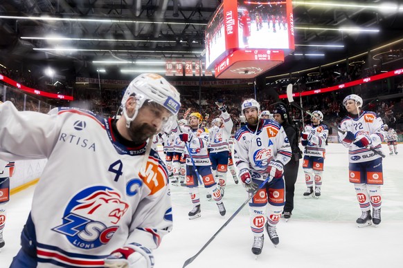 Lions&#039; players celebrate their victory after defeating the team Lausanne, during the first leg of the National League Swiss Championship final playoff game between Lausanne HC, LHC, and ZSC Lions ...
