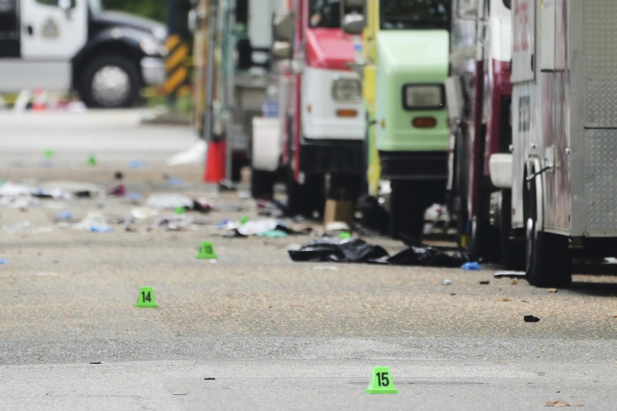 Evidence markers are seen the morning after a driver killed multiple people during a Filipino community festival, Sunday, April 27, 2025, in Vancouver, British Columbia. (AP Photo/Lindsey Wasson)
Cana ...