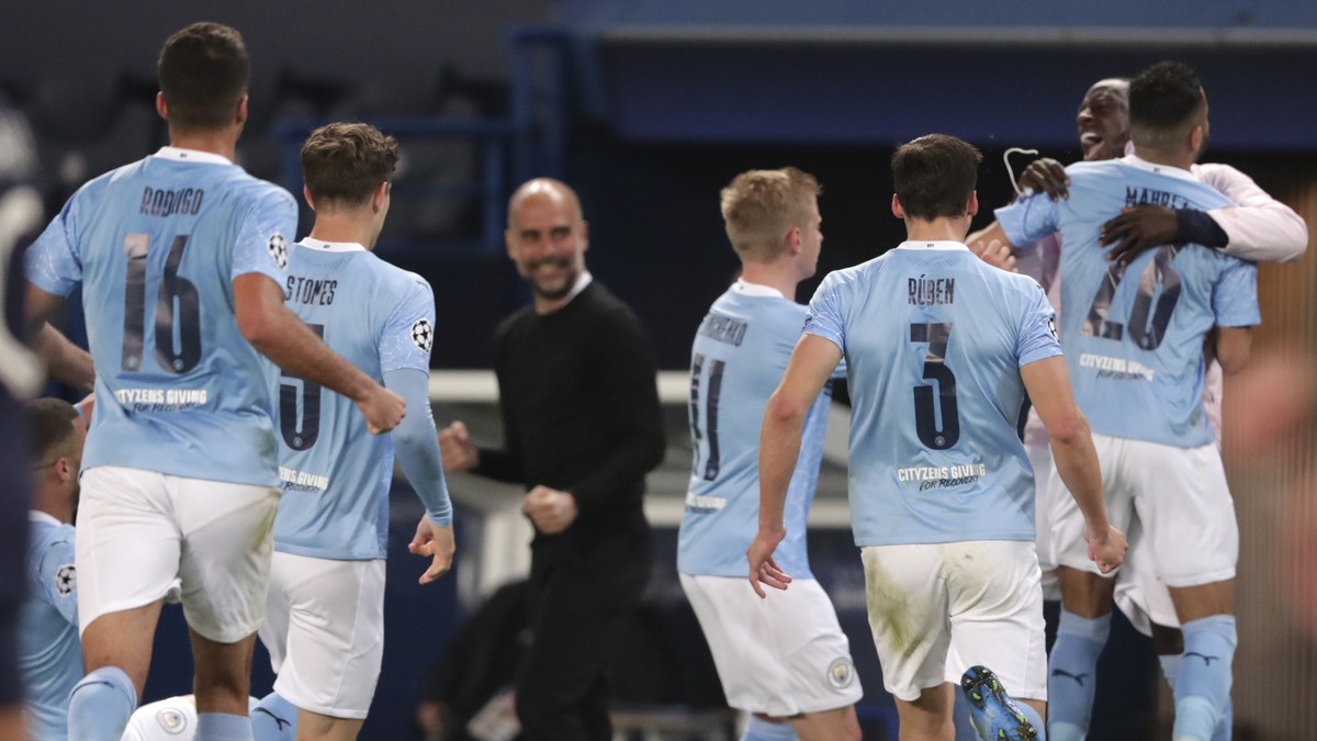 Manchester City's Riyad Mahrez celebrates with teammates after scoring his sides second goal during the Champions League semifinal first leg soccer match between Paris Saint Germain and Mancheste ...
