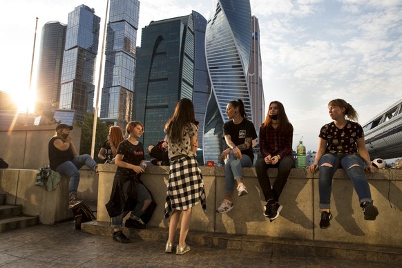 In this photo taken on Thursday, Aug. 18, 2016, a group of teenagers practice to dance a K-pop, a modern Korean dance during the warm weather at the Moscow&#039;s city skyscrapers in Moscow, Russia. K ...