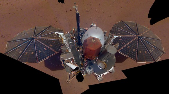 FILE - This Dec. 6, 2018 image made available by NASA shows the InSight lander. The scene was assembled from 11 photos taken using its robotic arm. The spacecraft is losing power because of all the du ...