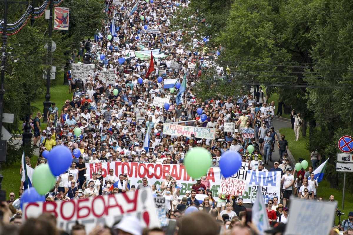 FILE People hold various posters supporting Khabarovsk region's governor Sergei Furgal, during an unsanctioned protest in support of Sergei Furgal, who was interrogated and ordered to be held in  ...