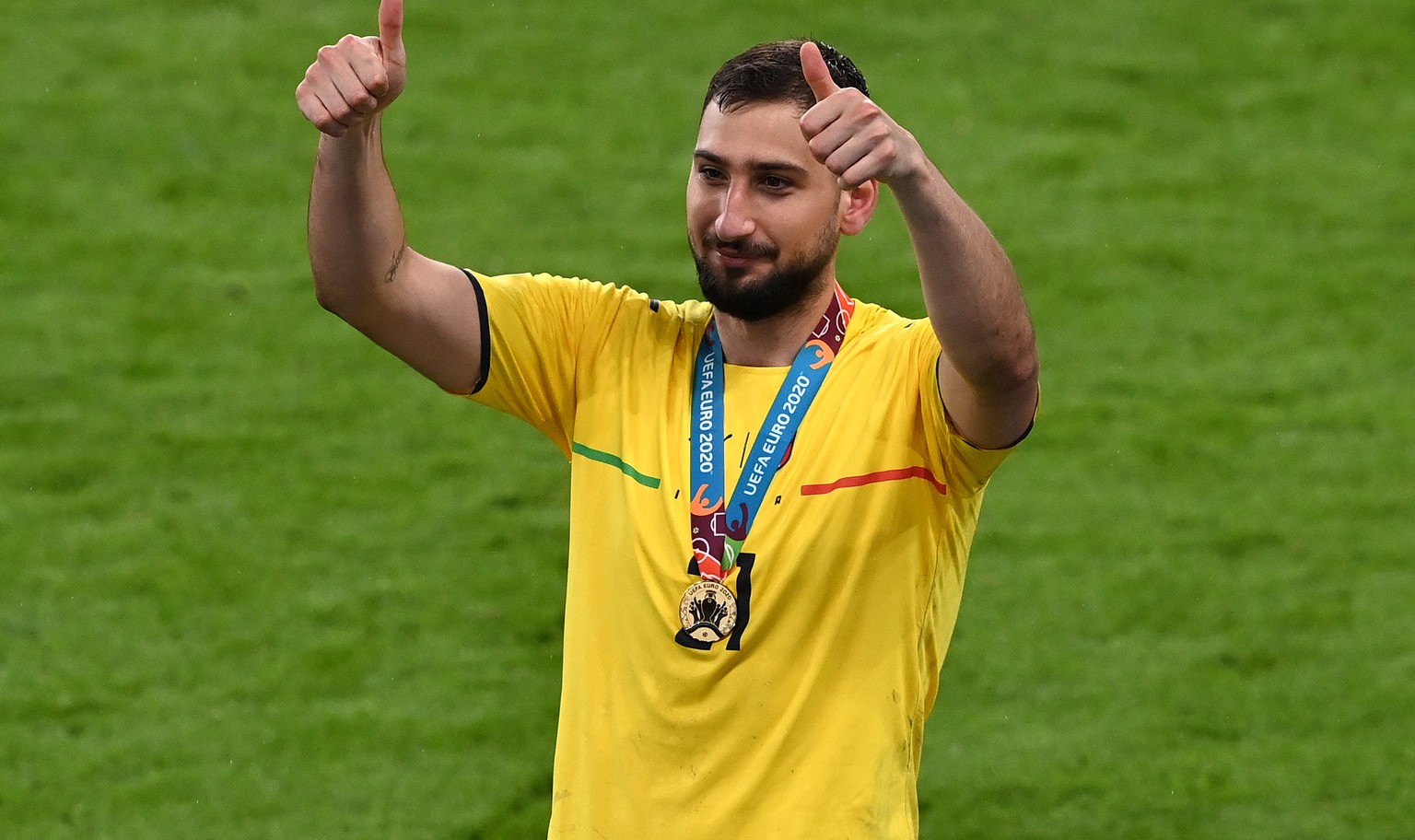 epa09339200 Goalkeeper Gianluigi Donnarumma of Italy gives the thumbs up after the UEFA EURO 2020 final between Italy and England in London, Britain, 11 July 2021. Italy won the match in penalty shoot ...