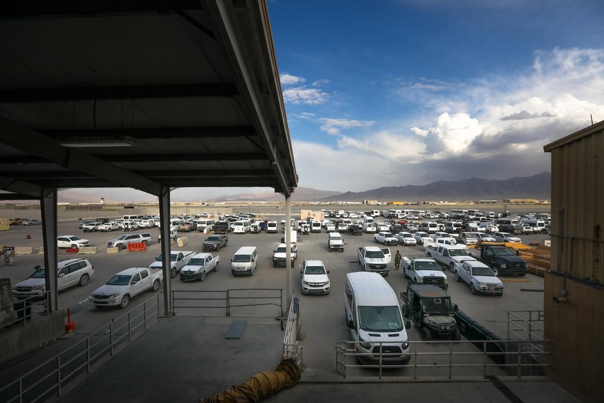 epa09324750 Vehicles left by the US military are seen parked inside the Bagram Air Base, some 50 kilometers north of the capital Kabul, Afghanistan, 05 July 2021. After nearly two decades, the US mili ...